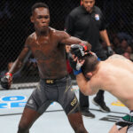 Israel Adesanya defeats Robert Whittaker to retain his middleweight title at UFC 271 in Houston, Texas.